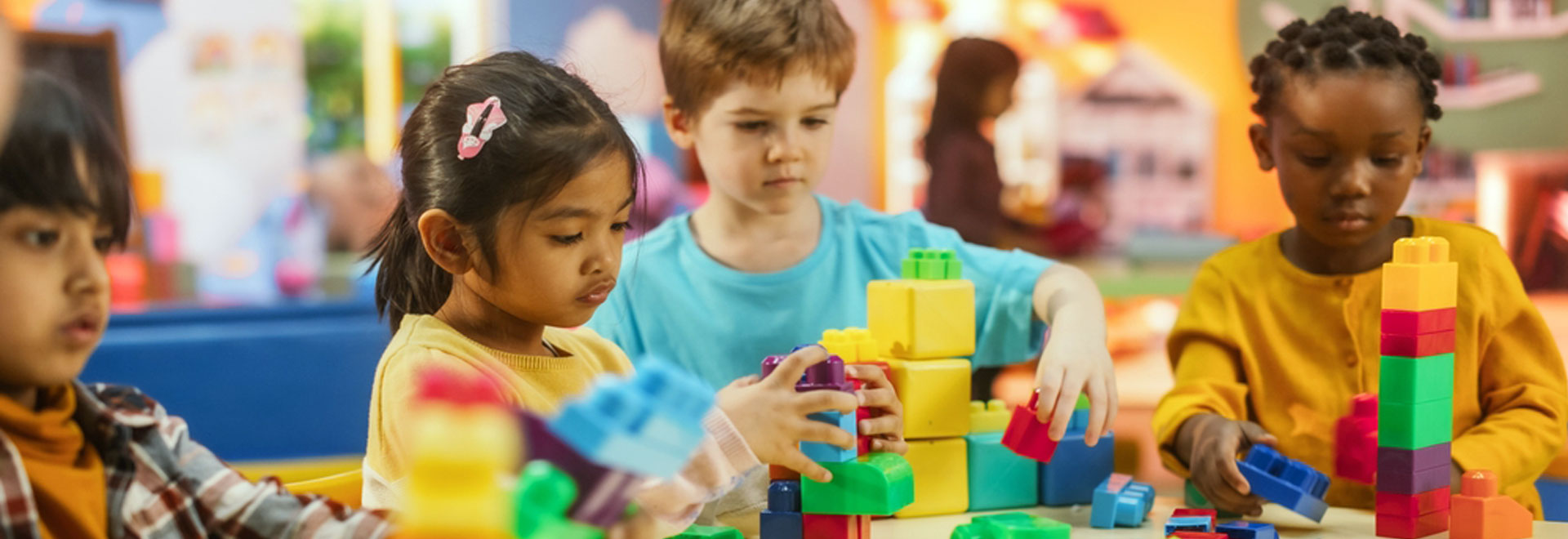 elaglobal smiling children learning, coding, crafting, or engaged in teamwork.